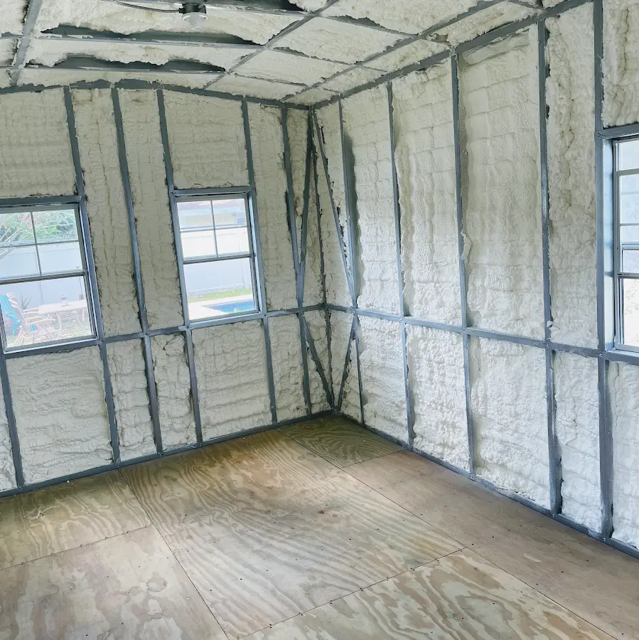 Closed-cell spray foam insulation applied to wall cavities in a residential project in Dos Palos